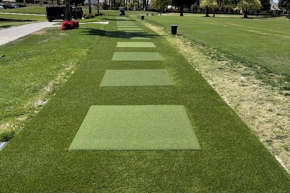 Flagstaff Outdoor tee line with light green synthetic grass boxes inside a dark green synthetic grass strip